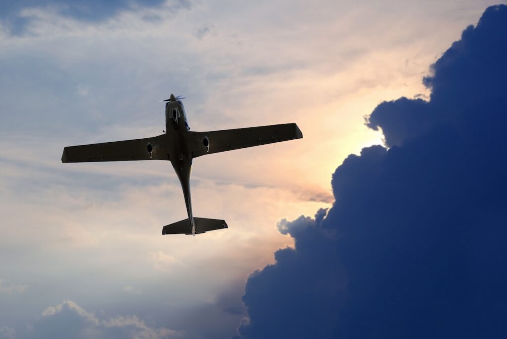 Single Engine Light Aircraft Flying In The Sky